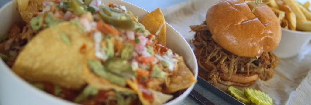 Bark 'N Brine nachoes, pulled port sandwich, and fries