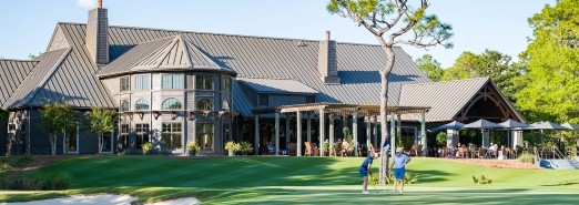 Shark's Tooth Golf Course aerial view of the clubhouse with Watersound Club Members enjoying the patio