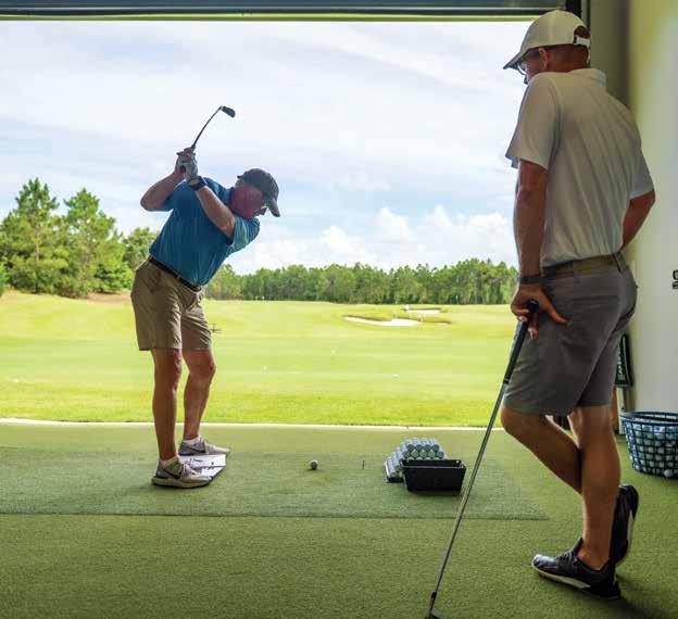 A Watersound Club Member practices his golf swing at the performance center in Camp Creek.