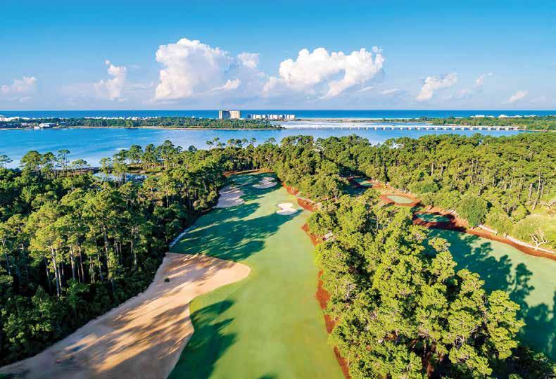 Aerial view of the 18th hole at Shark's Tooth Golf Course, overlooking Lake Powell and the Gulf of Mexico beyond.