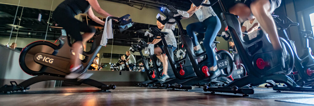 Watersound Club Members enjoy a cycling class at the Wellness Center