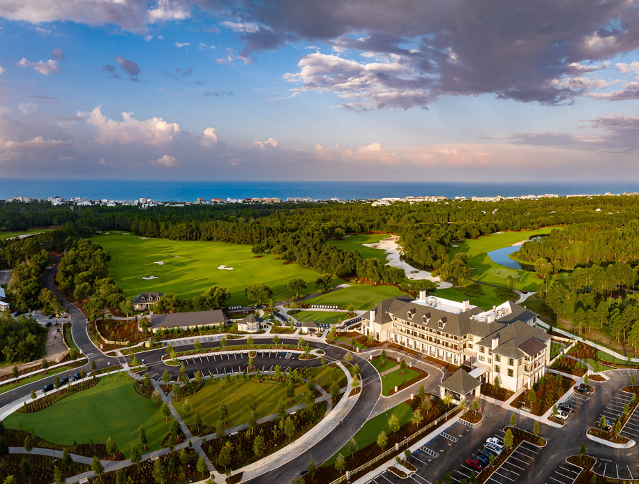 Aerial view of Camp Creek Inn at dusk with the Gulf of Mexico in the background