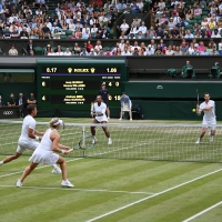 Alexa Guarachi and Andreas Mies playing against Serena Williams and Andy Murray in a mixed doubles match at Wimbeldon