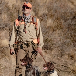 John Lemont hunting with his two bird dogs