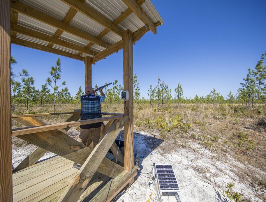 A shooter takes his stance on one of 15 stations at the Watersound Club Sporting Preserve sporting clays course